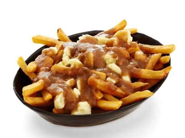 Canadian poutine with fries with melted cheese curd and gravy