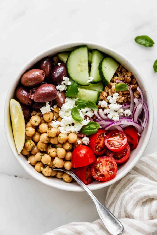 Greek Freshie - A bowl of fresh salad with feta, olives and greek dressing