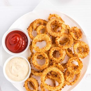 Golden and crispy onion rings with two dipping sauce on side