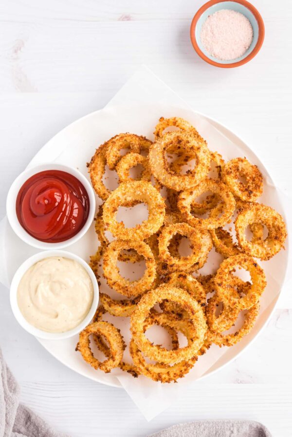 Golden and crispy onion rings with two dipping sauce on side