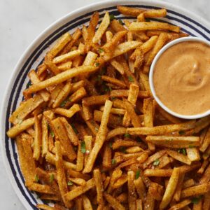 A crispy and spicy potato fries with dipping sauce