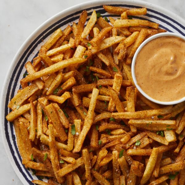 A crispy and spicy potato fries with dipping sauce